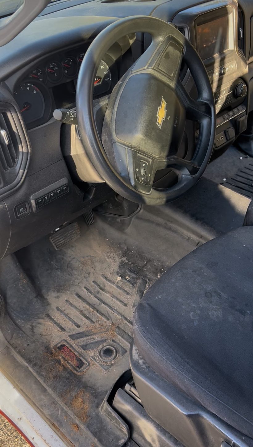 Truck cabin before detailing — dirt on floor mats