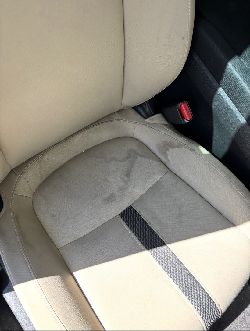 Car seat before detailing — staining on upholstery